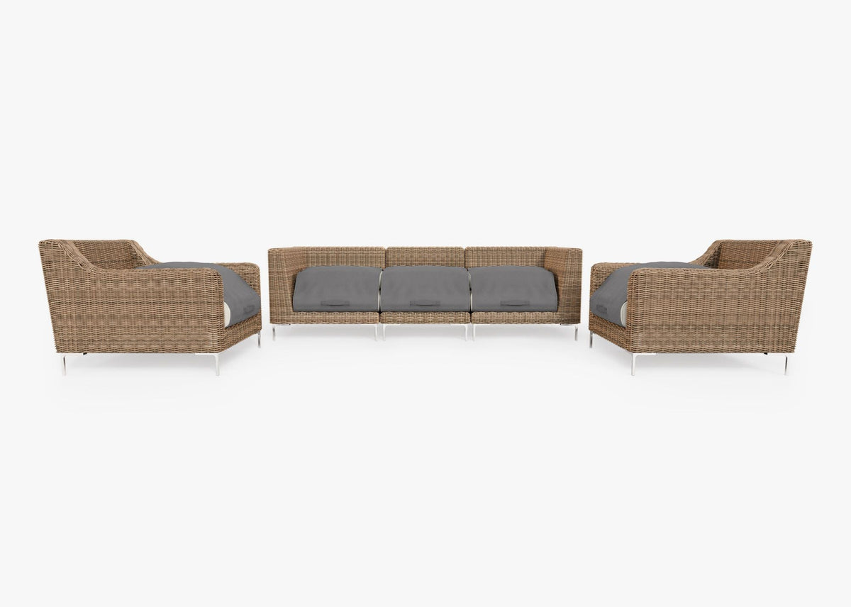 Handwoven brown wicker outdoor sofa with two armchairs and three modular sections, featuring gray layered cushions.
