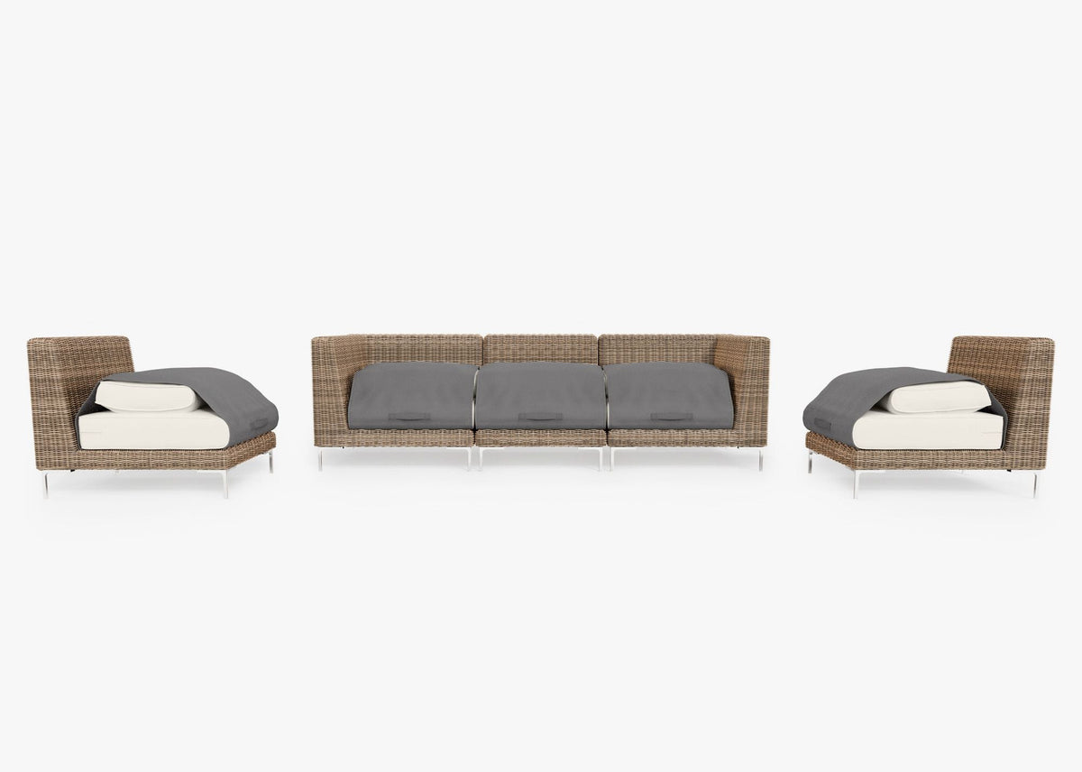 Handwoven brown wicker outdoor sofa set with three armless chairs and layered gray cushions, arranged in a modular layout.