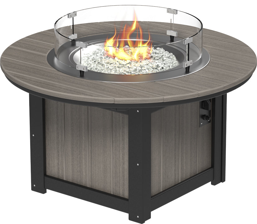 Rectangular fire pit table with a gray wood top, stainless steel burner, and clear fire glass, featuring glass wind guard.