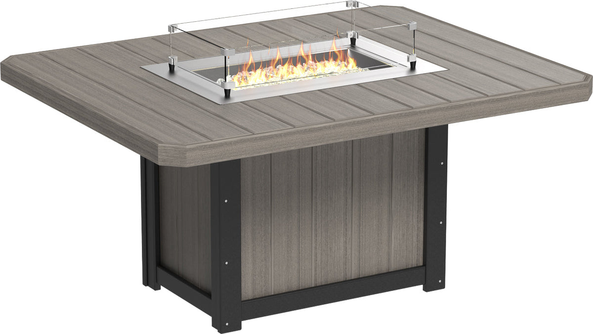 LuxCraft Lumin 62" Rectangular Dining Height Fire Table with a gray tabletop, stainless steel burner, and tempered glass wind guard.