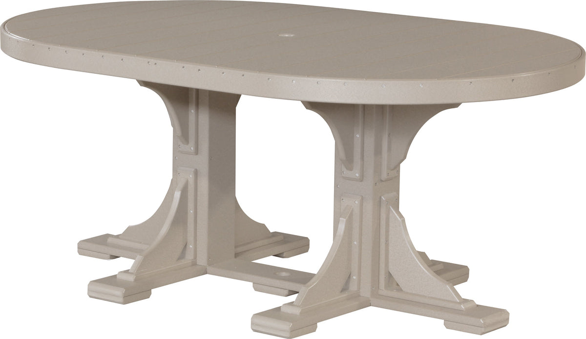 LuxCraft Deluxe Poly 4' x 6' oval dining table in light tan, featuring sturdy marine-grade legs and an umbrella hole.