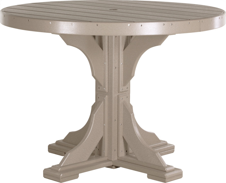 LuxCraft Deluxe Poly 48" round dining table in a light tan color with a sturdy base and an umbrella hole in the center.