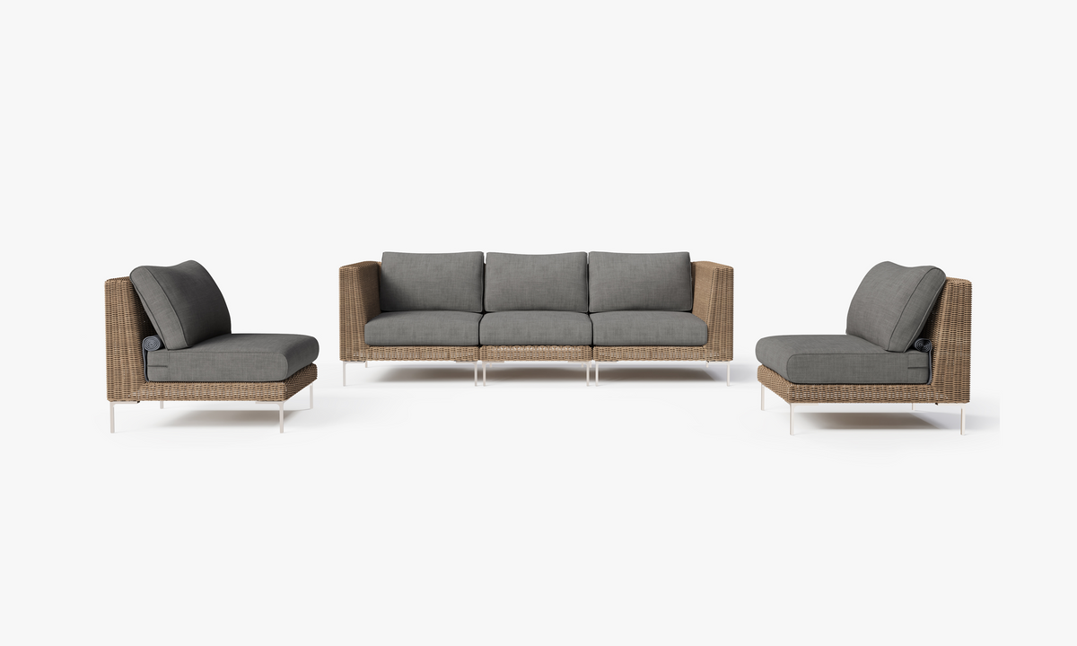 Five-seat brown wicker outdoor sofa set with modular armless chairs, featuring gray layered cushions and polished legs.