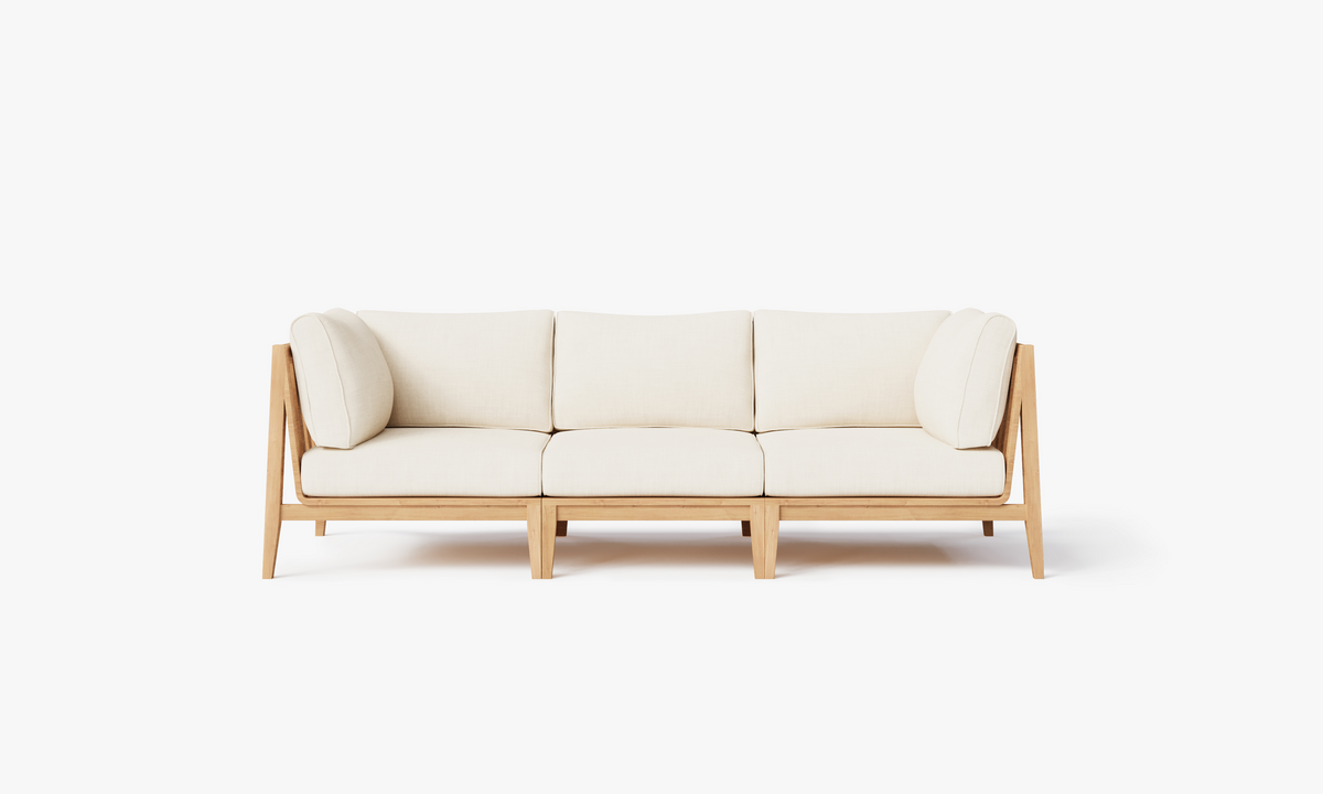 Three-seat outdoor sofa made of FSC-certified teak with cream cushions and a modular design for flexible seating.
