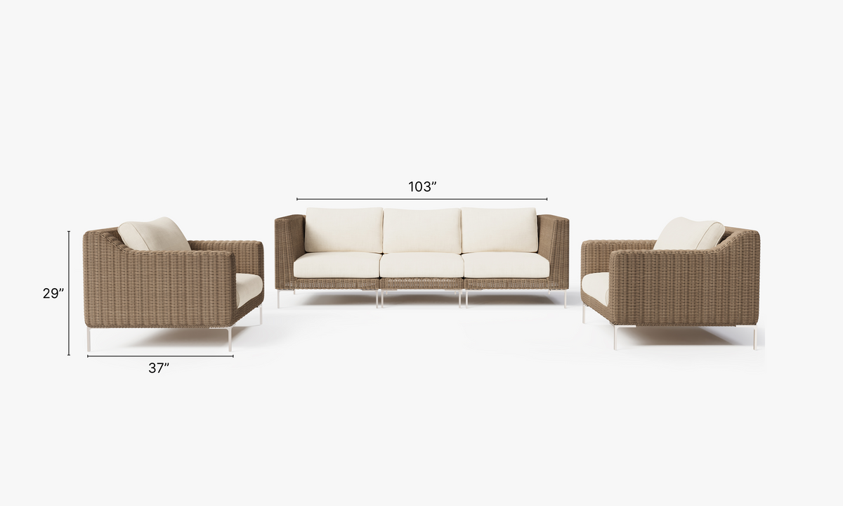 Handwoven brown wicker outdoor sofa seating five, with cream plush cushions and polished stainless steel legs.
