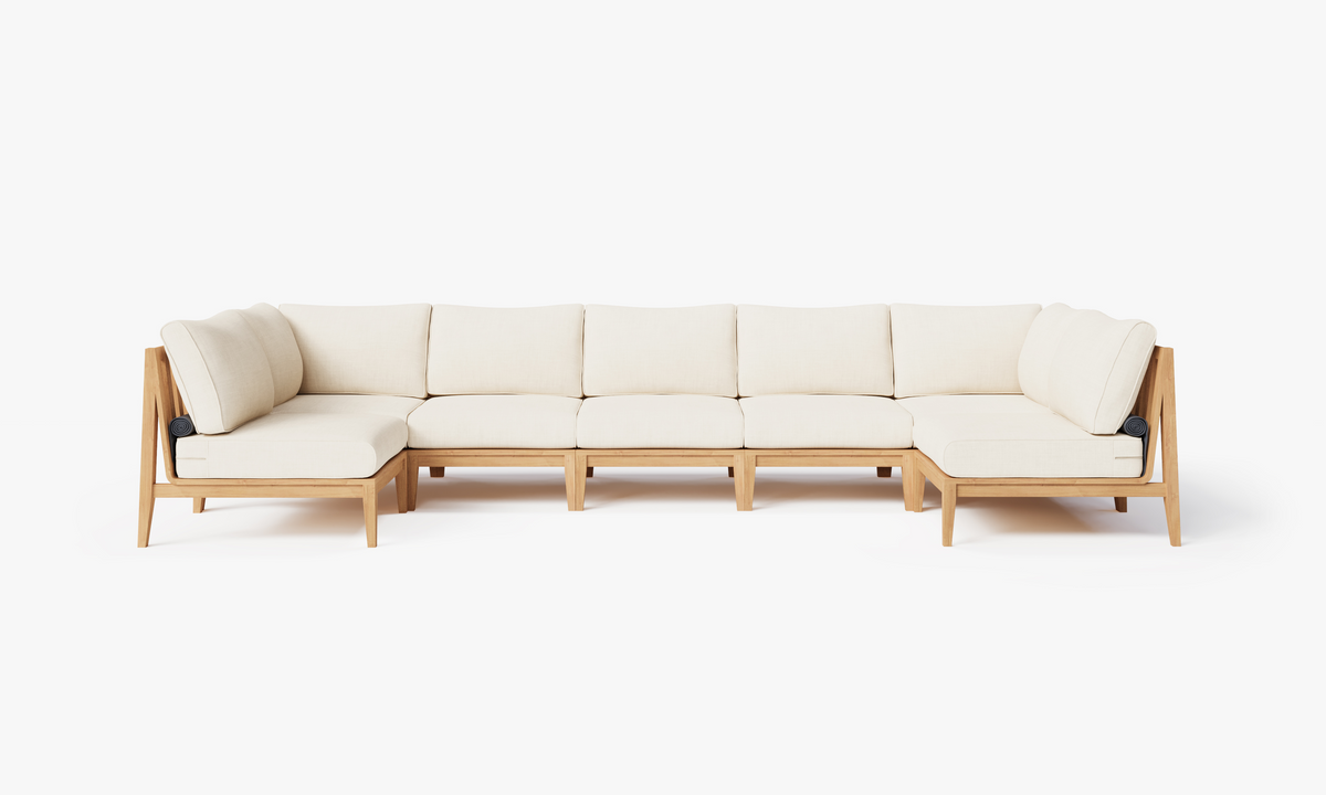 Teak U-shaped sectional sofa with cream cushions and a natural wood frame, designed for seven seating spaces.