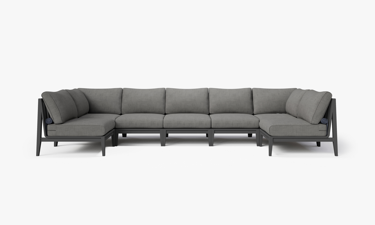 Charcoal aluminum outdoor U-shaped sectional sofa with layered gray cushions, designed for seven-seat capacity.
