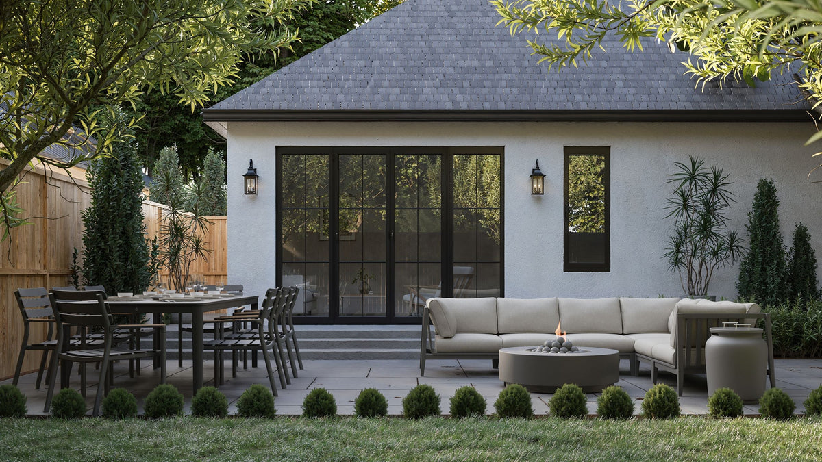 OuterStone® Outdoor Dining Table with eight armless chairs in sleek aluminum, showcasing Glacier White tabletop on a patio setting.