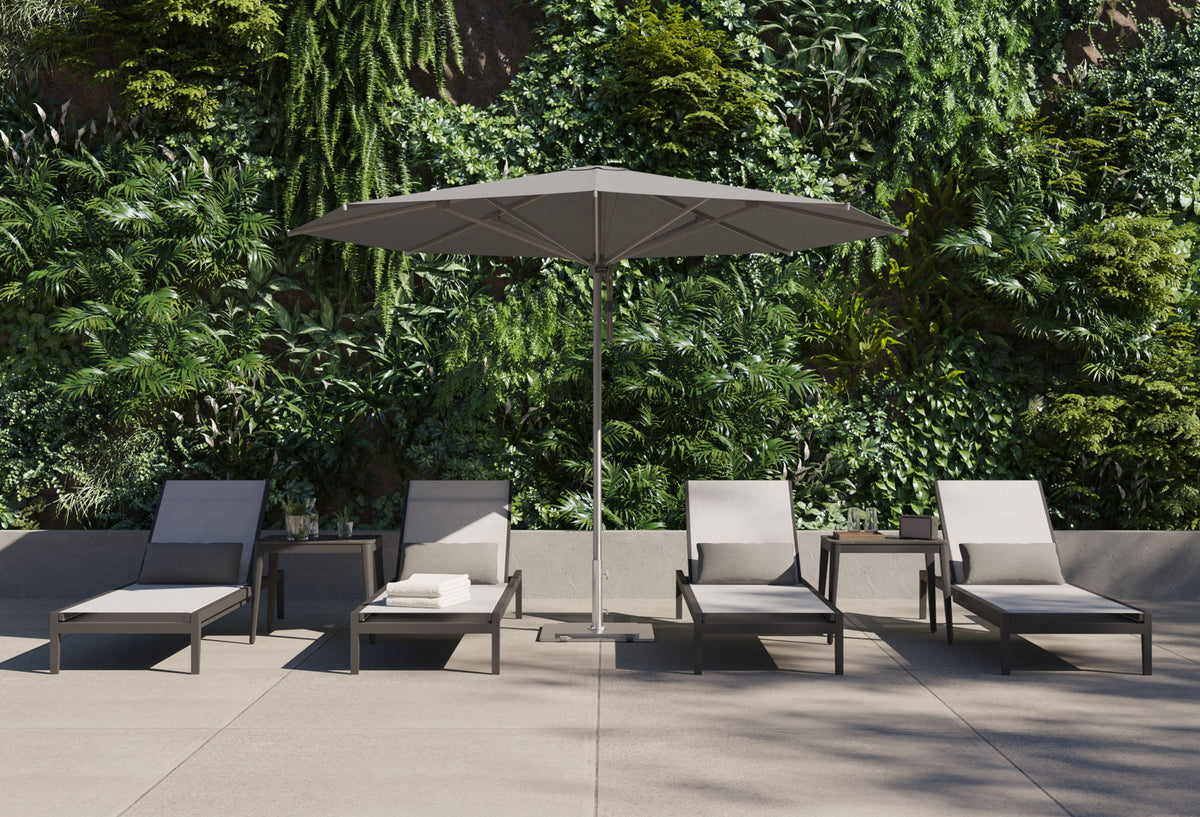 Charcoal aluminum chaise lounge with a modern design, adjustable backrest, and sleek sling fabric in a stylish outdoor setting.