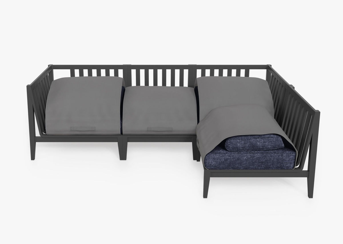 Charcoal aluminum outdoor L sectional featuring layered gray cushions, modular design, and sleek slatted back.