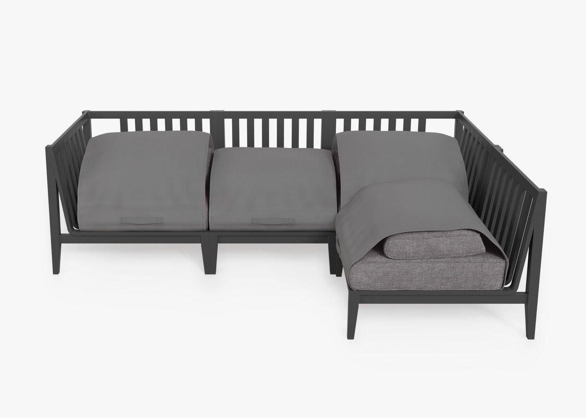 Charcoal aluminum L-shaped sectional with gray cushions, featuring a modular design and slatted backrest for outdoor use.