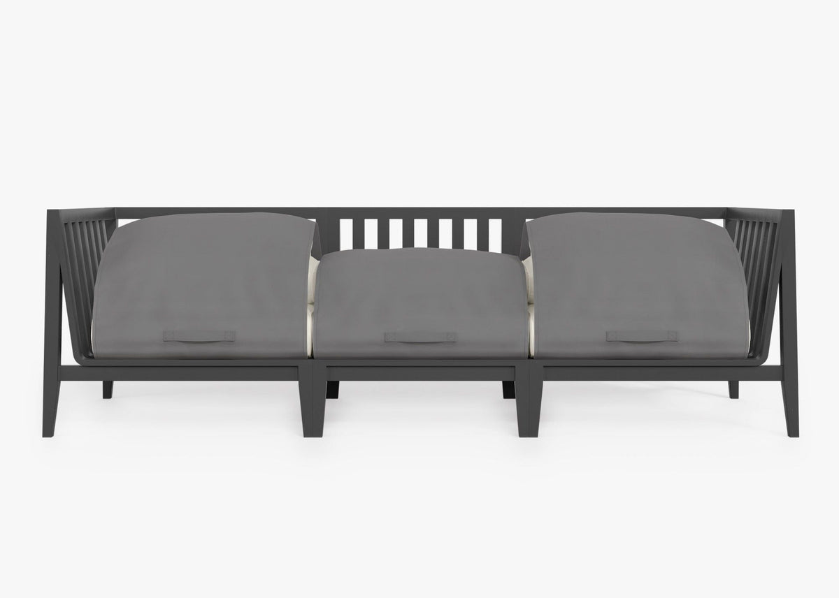 Charcoal aluminum three-seat outdoor sofa with layered gray cushions and integrated protective covers.