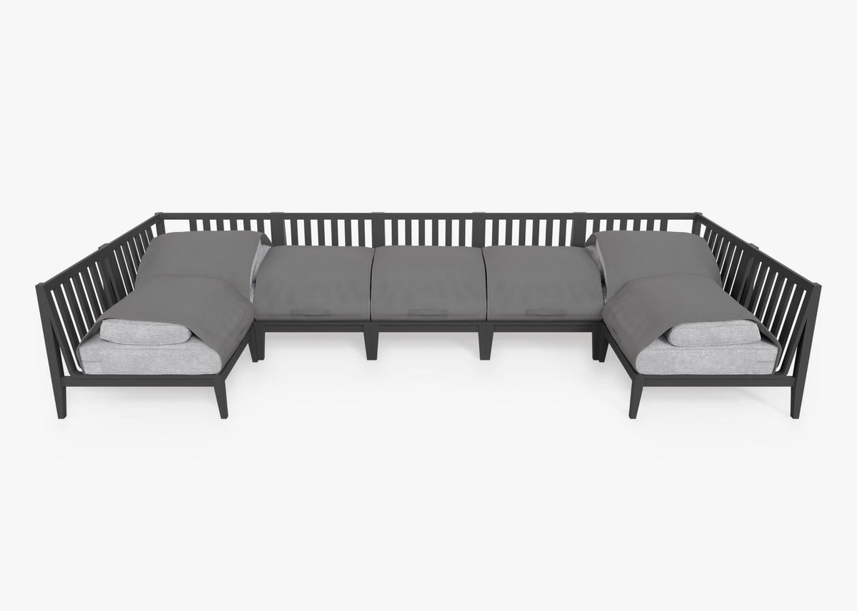 Charcoal aluminum U-shaped sectional seating with five armless and two corner chairs, featuring layered gray cushions.