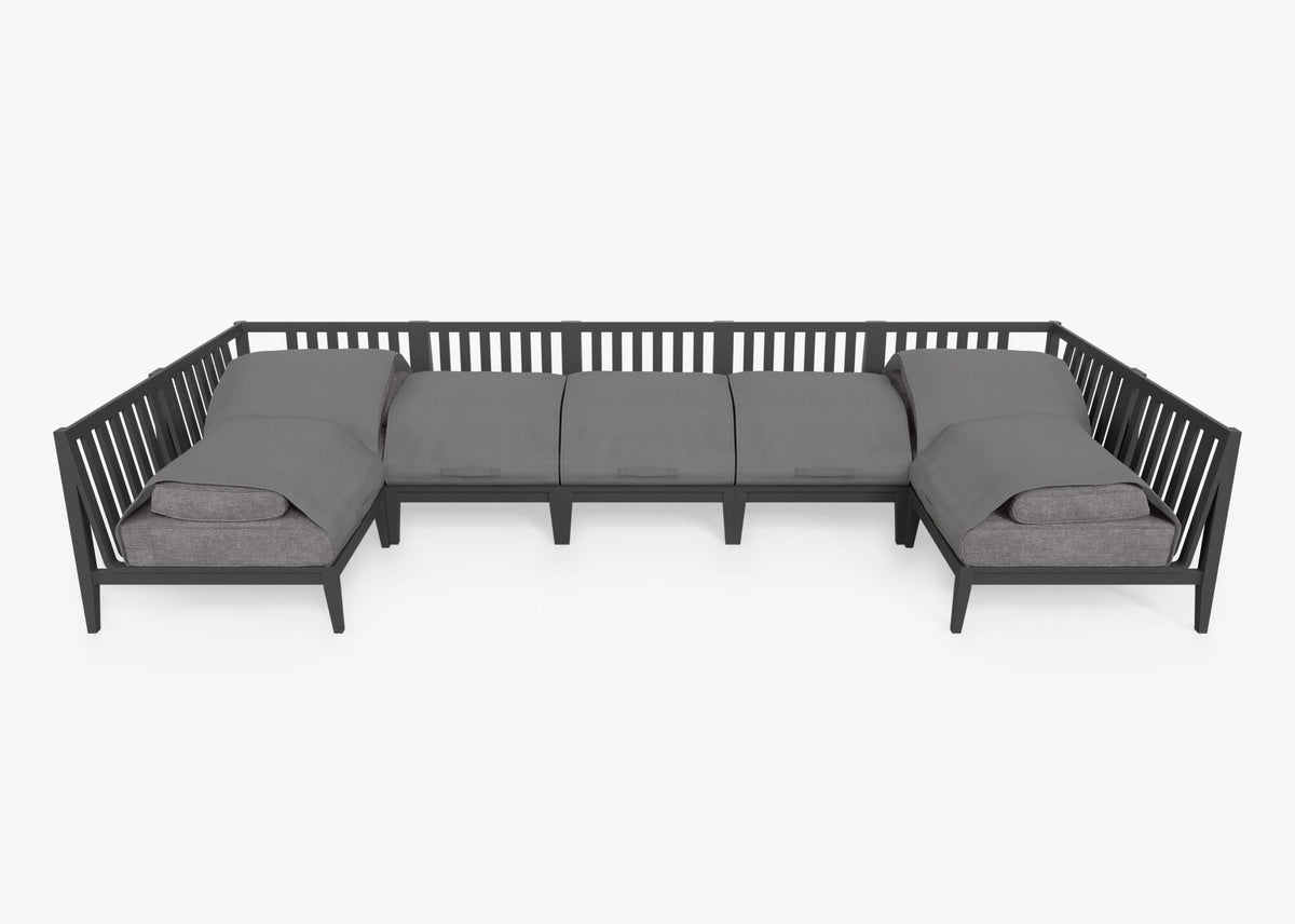 Charcoal aluminum U-shaped sectional sofa with five armless and two sectional chairs, featuring layered gray cushions.