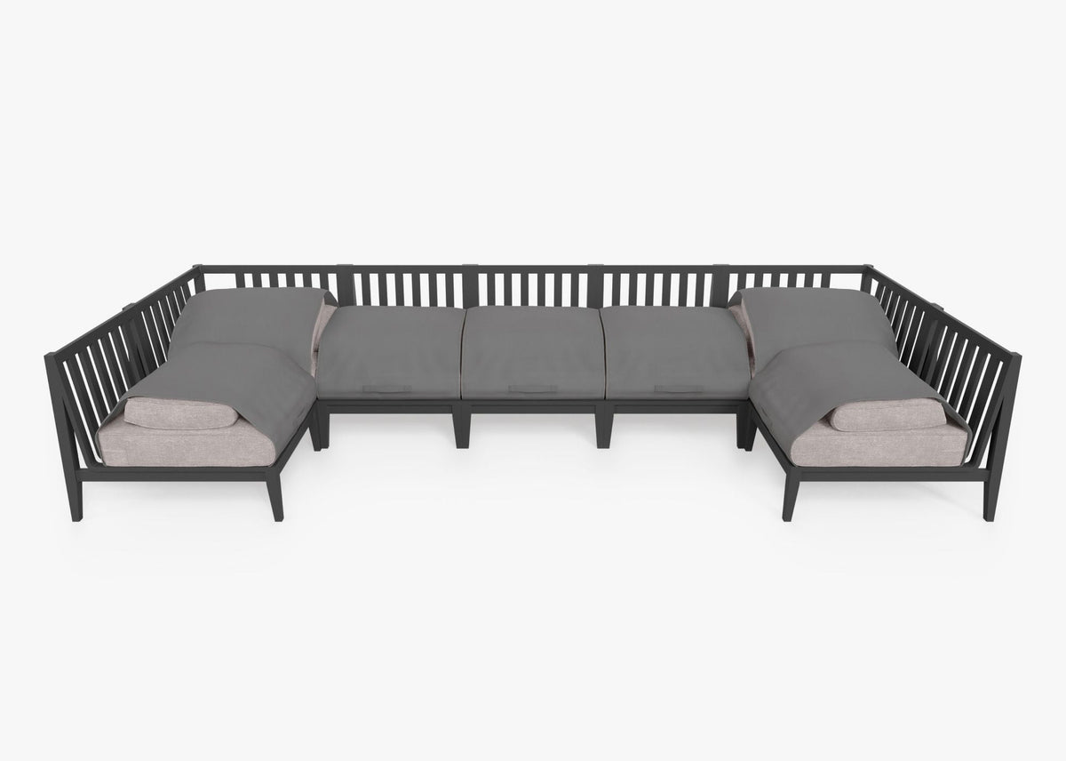 Charcoal aluminum outdoor U-shaped sectional with layered gray cushions, designed for seven seats, showcasing a modular layout.