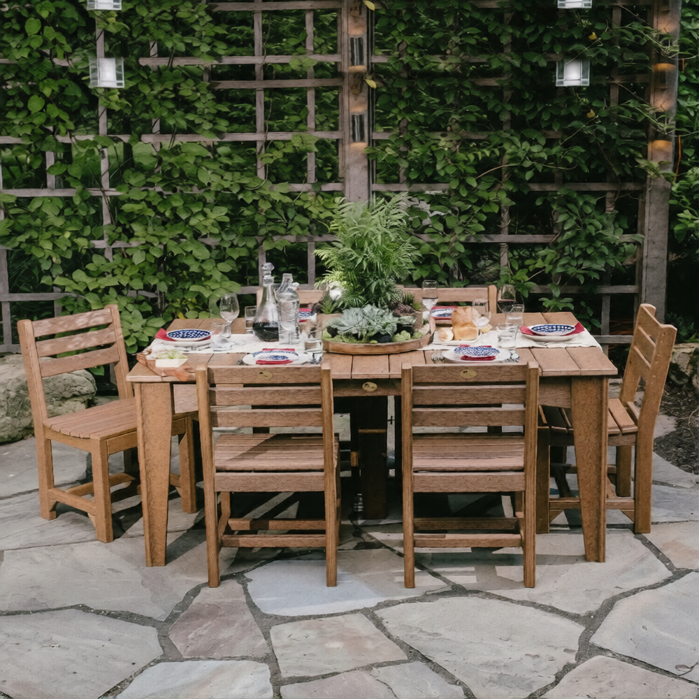 LuxCraft 44" x 72" Island Dining Table Set features a spacious wooden tabletop with six attached chairs, set on a stone patio.