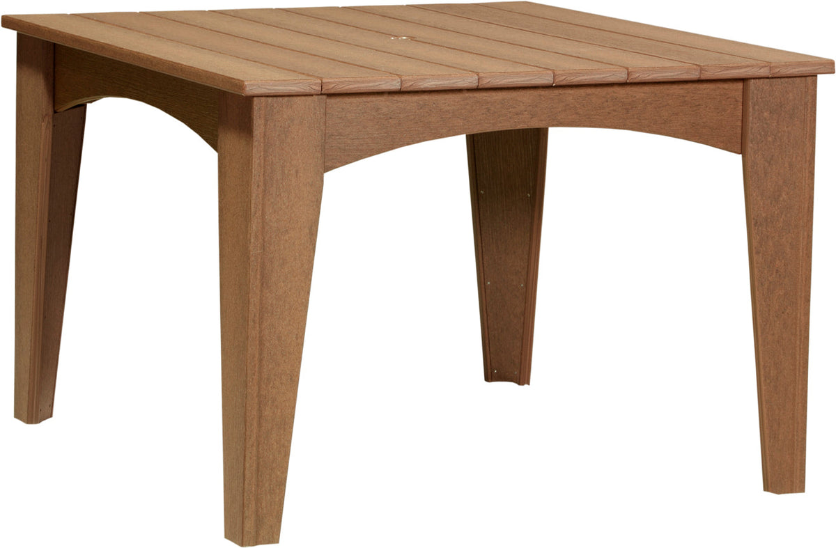 Round, brown poly lumber table with slatted top and sturdy legs, designed for outdoor dining, seating four comfortably.