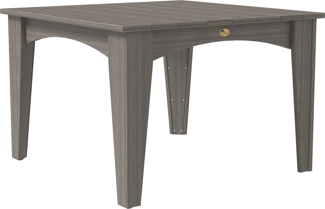 Round 44" dining table with a gray HDPE wood-like finish, sturdy legs, and a center umbrella hole. Seats four comfortably.