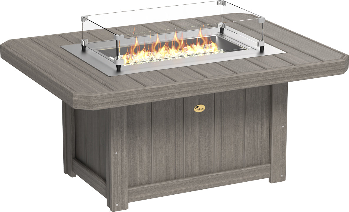 Rectangular LuxCraft Lumin fire pit table in a grey finish with a stainless steel burner, glass wind guard, and fire glass gems.