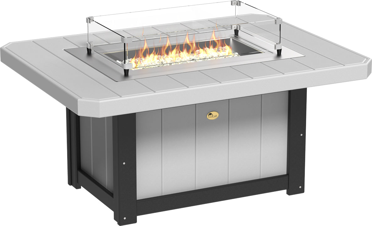 Rectangular fire pit table with a gray top and black base, featuring a glass wind guard and flames with reflective fire glass.