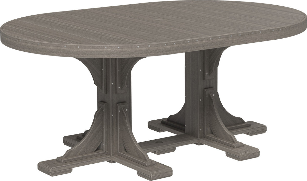LuxCraft Deluxe Poly 4' x 6' oval dining table in a textured gray finish, showcasing a sturdy base and integrated umbrella hole.