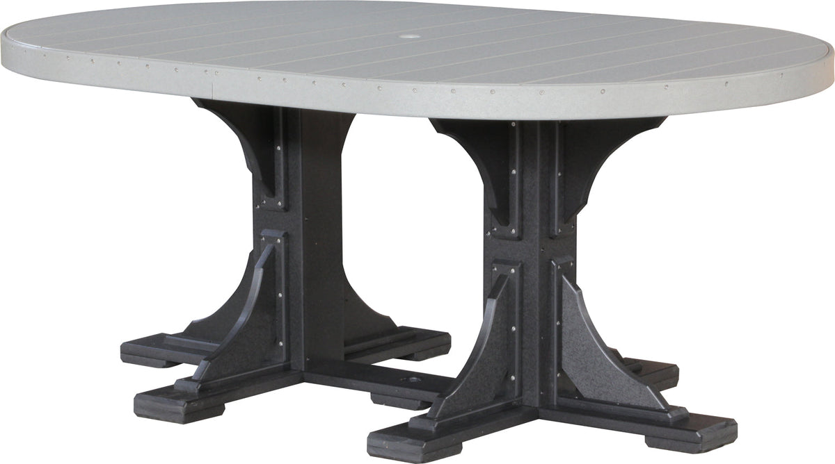 Gray oval dining table with black, sturdy bases. Includes a center umbrella hole for shade. Space for six adults.