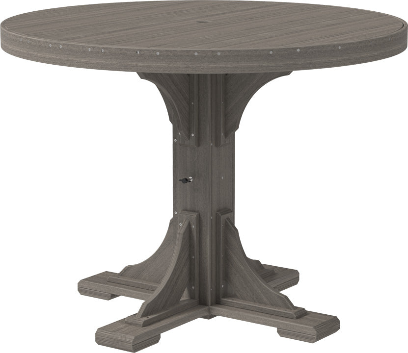 Round gray patio table with a sturdy base and smooth surface, designed for four people, featuring a central umbrella hole.