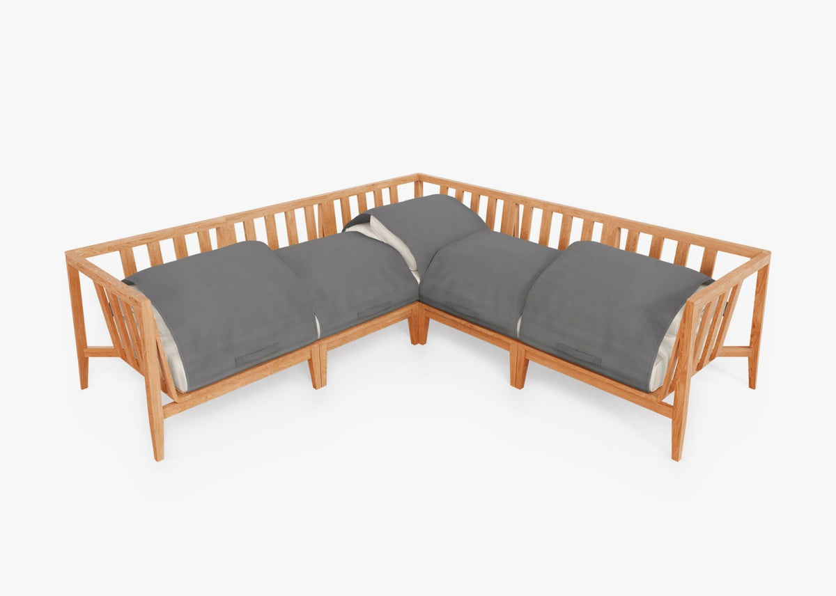 Teak outdoor corner sectional with modular design, featuring gray cushions and an integrated cover for protection.