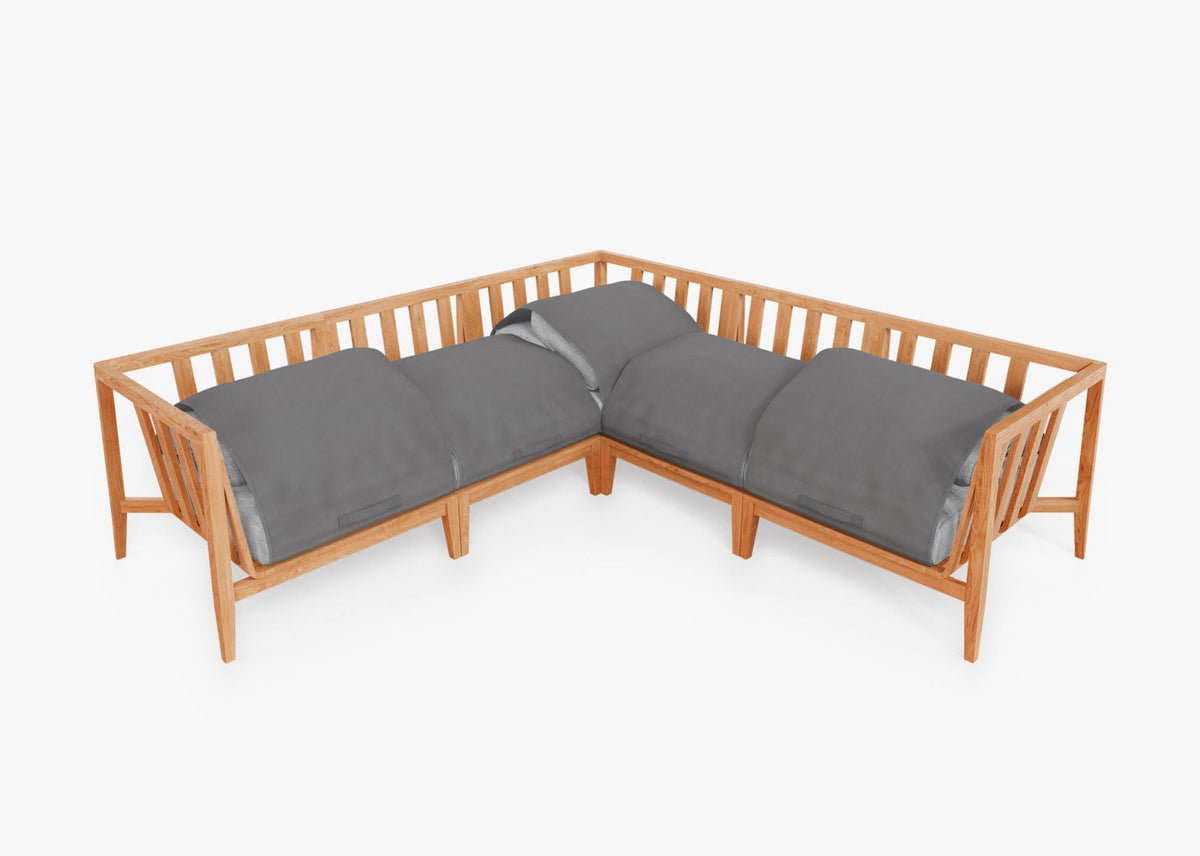 Teak outdoor corner sectional with gray cushions; modular design featuring open slats and a natural wood finish.