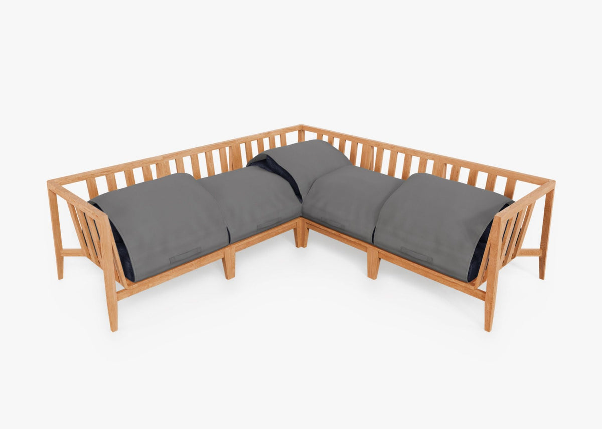 Teak outdoor corner sectional with gray cushions and integrated cover, featuring a modular design for flexible arrangement.