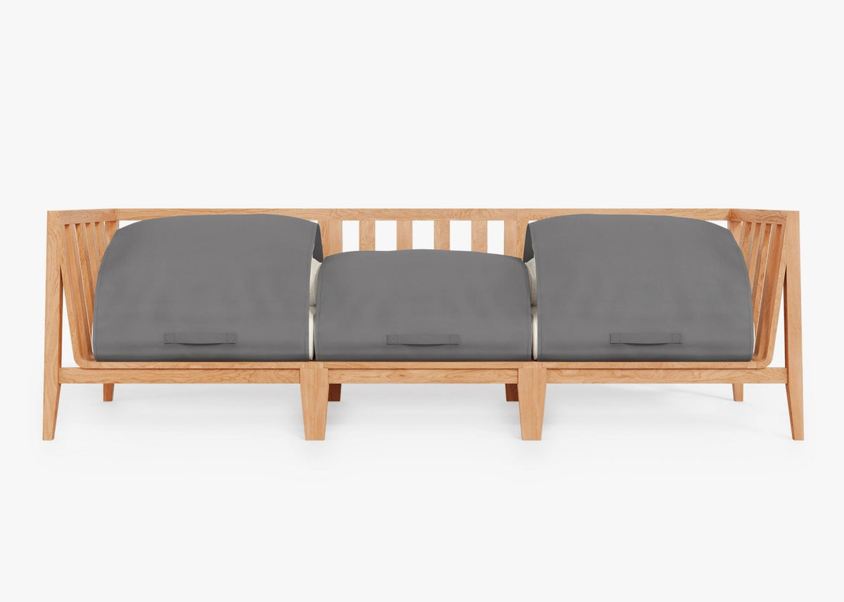 Teak wood three-seat outdoor sofa with gray protective covers, showcasing a modular design and slatted backrest.