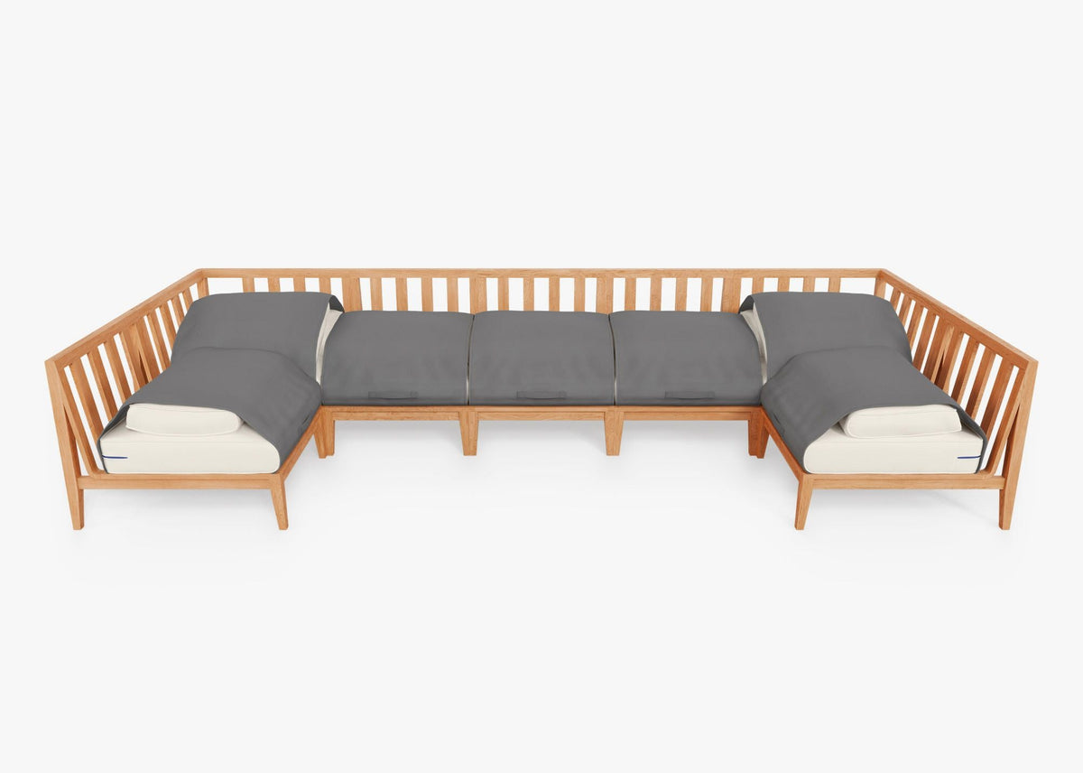 Teak outdoor U-shaped sectional seating with gray cushions, featuring slatted back and modular design for seven seats.