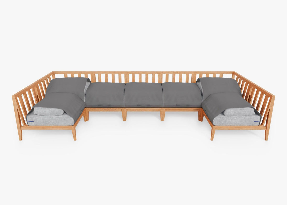 Teak U-shaped sectional sofa featuring five armless chairs and two sectional chairs with gray cushions.