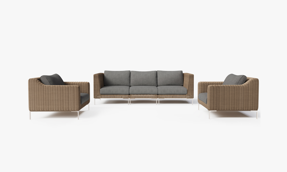 Handwoven brown wicker outdoor sofa set with gray cushions, featuring two armchairs and a central 3-seat sofa.