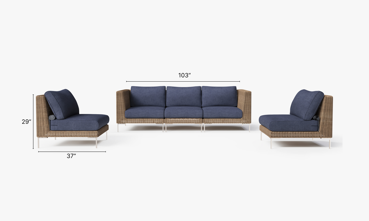 Handwoven brown wicker outdoor sofa set featuring three armless chairs and two corner chairs with navy cushions.
