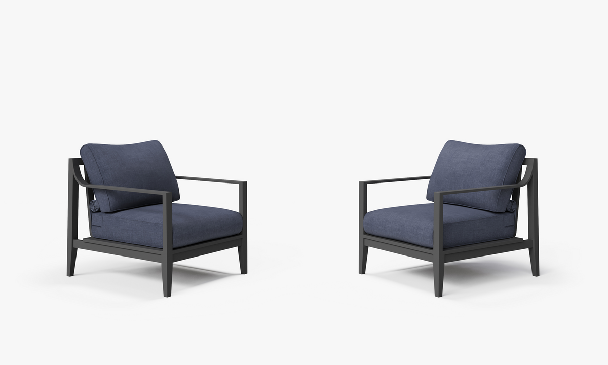 Charcoal aluminum outdoor armchair set with plush navy cushions, featuring a modern design and clean lines.