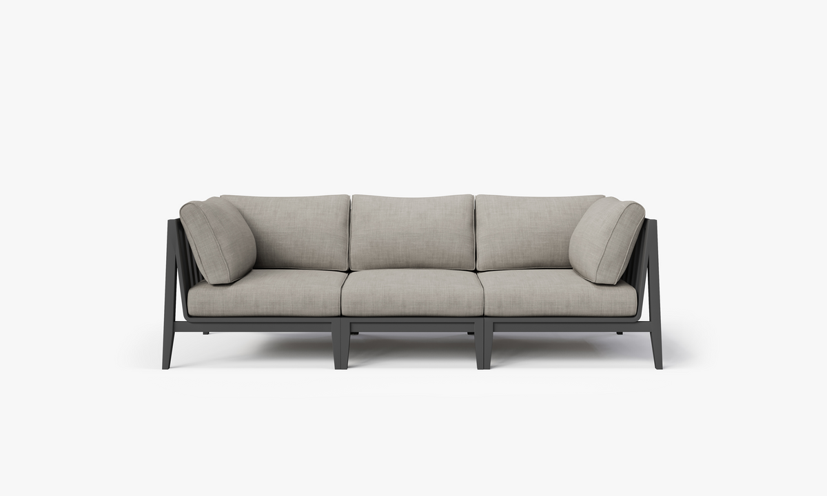 Three-seat outdoor sofa in charcoal aluminum, featuring layered memory foam cushions in light gray fabric with modern design.