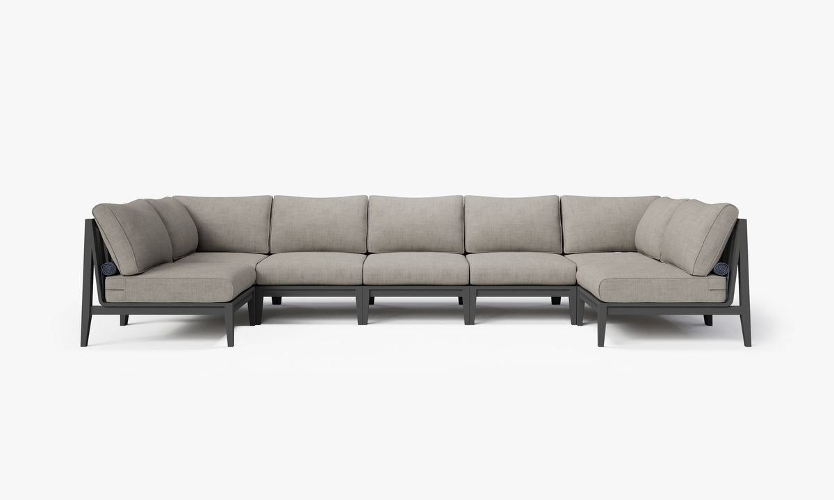 Charcoal aluminum U-shaped sectional with plush gray cushions, designed for outdoor seating and gatherings.