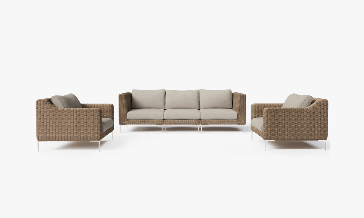 Handwoven brown wicker outdoor sofa set with beige cushions, includes two armchairs and a long central sofa.