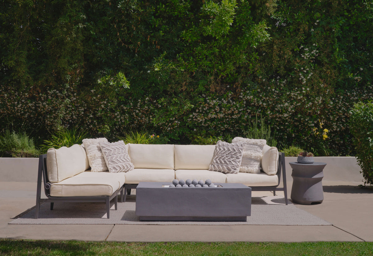 Charcoal aluminum outdoor armchair set with plush cream cushions, integrated covers, modern design, and no assembly required.
