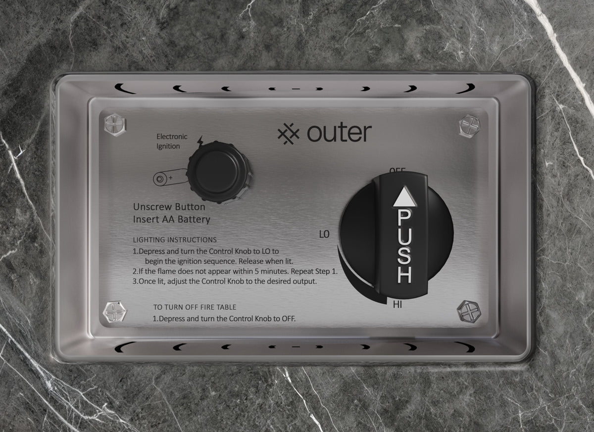 Control panel of the OuterStone® Fire Pit, featuring electronic ignition, a black control knob, and lighting instructions on a sleek metal surface.